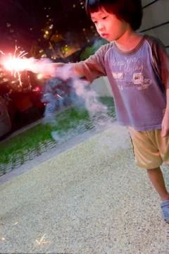 Boy with fire crackers Stock Photos