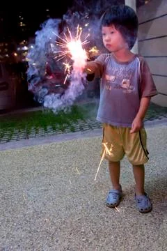 Boy with fire crackers Stock Photos