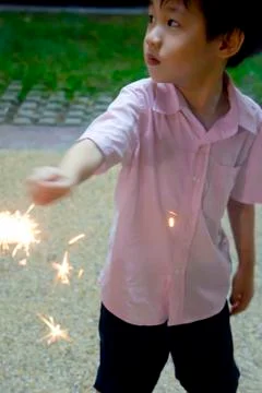 Boy with fire crackers Stock Photos