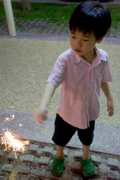 Boy with fire crackers Stock Photos