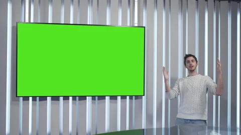 Boy first stunned and then laughs in front of a green screen Stock Footage 144246174