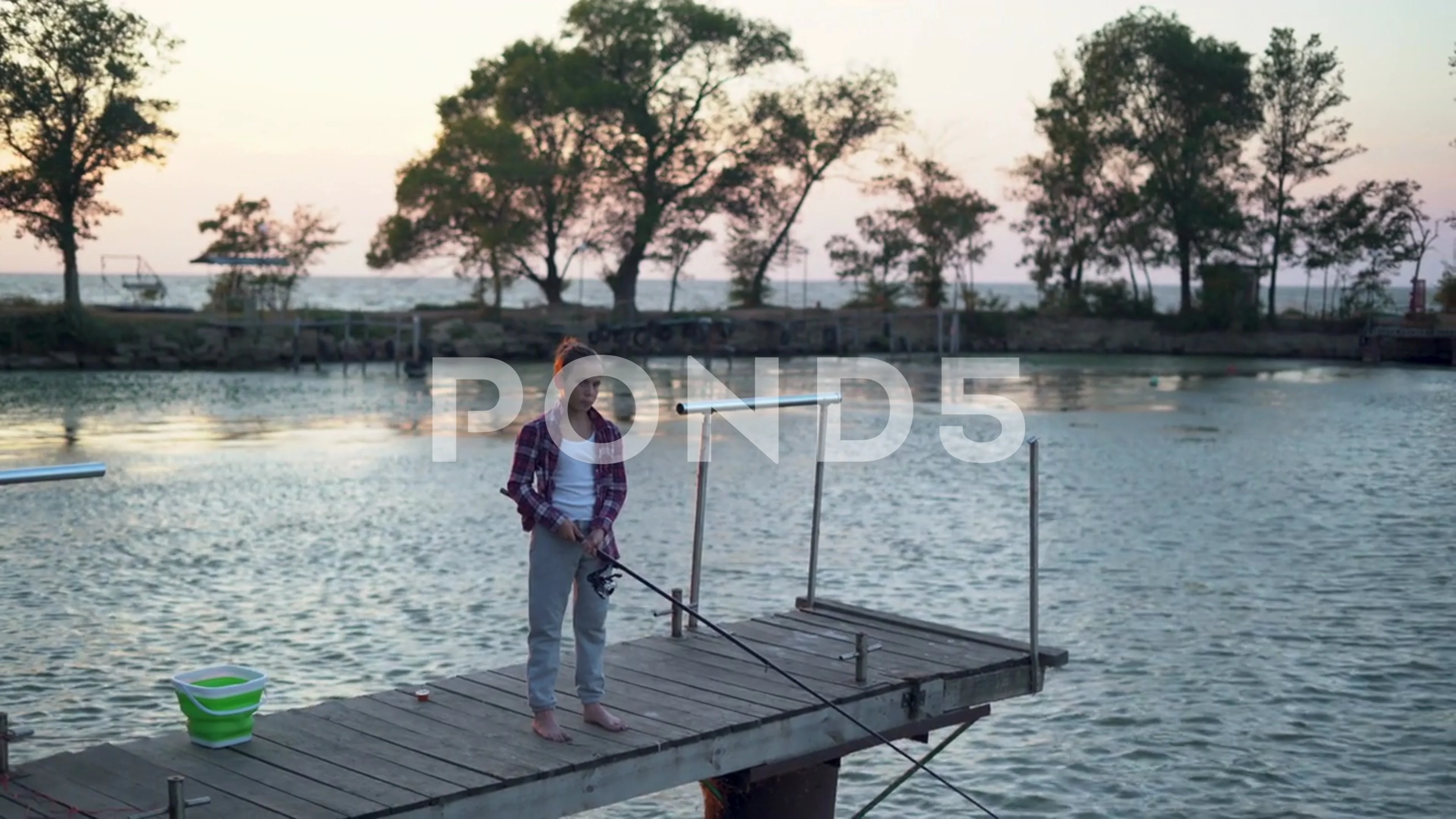 boy fishman with fishing rod by the lake, Stock Video