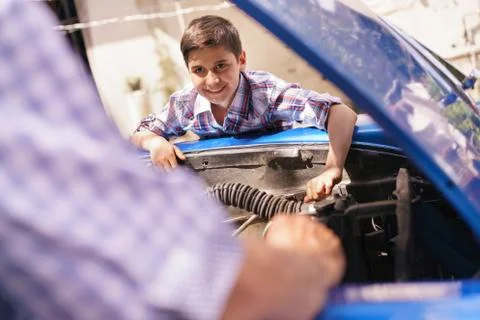 Boy Fixing Car Engine With Old Man Grandpa Stock Photos