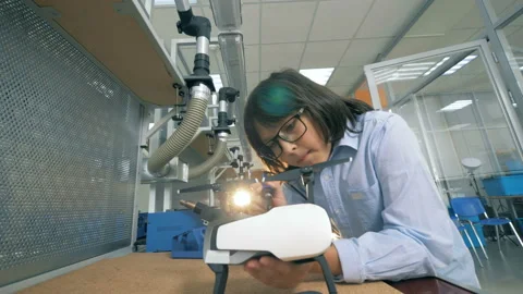 Boy fixing a drone in a school lab. Stock Footage 97843379