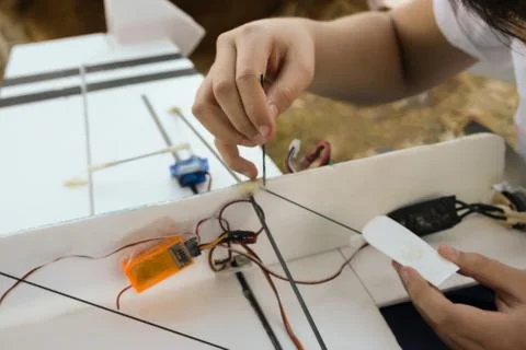Boy fixing model airplane RC Stock Photos