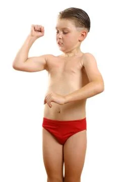 Boy flexing biceps muscles Stock Photos
