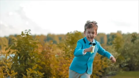 A Boy Flies a Kite in the Sky Stock Footage 68926599