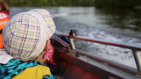 The boy floating on a boat Stock Footage 78717869