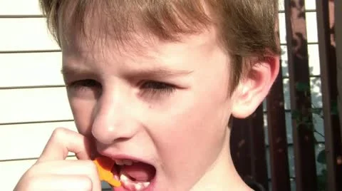 Boy Flossing Teeth in Sun Video stock 12571681