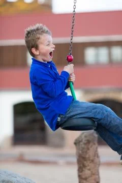 Boy on flying fox Stock Photos