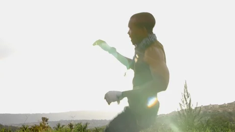 A boy flying in the sky through the ramp with rollerblades in slow motion. Stock Footage 110810287