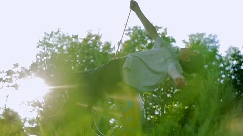 The boy is flying on the wheel 스톡 동영상 78181958