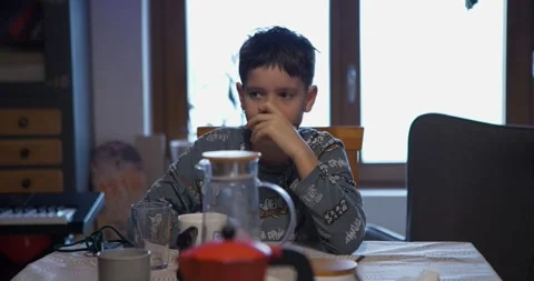 The boy is focused on the mobile match. Stock Footage 326876233