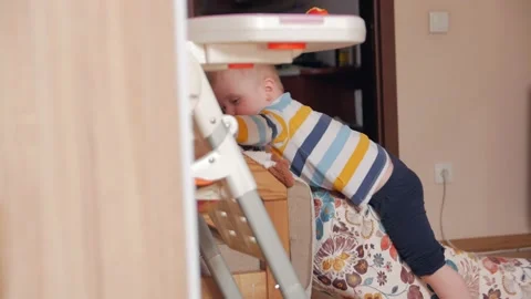 Boy Fooling Around With Pillows Stock Footage 151787287