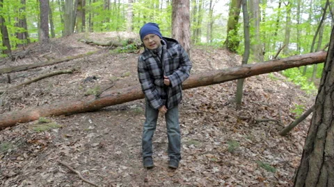 The boy in the forest smiles Stock Footage 156956040