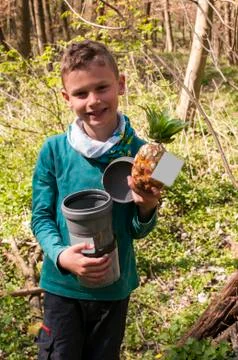 Boy found a well hidden cache in a tube with pineapple Stock Photos