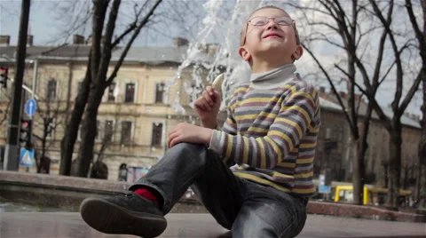Boy at the fountain Stock Footage 65752744