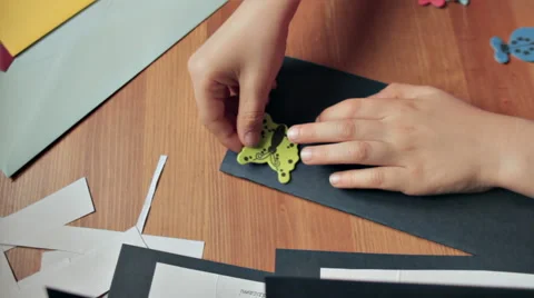 BOY IN FRONT OF THE DESK MAKING PARTY INVITATIONS Stock Footage 68755618