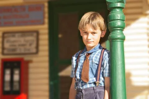 Boy in front of shop Stock Photos