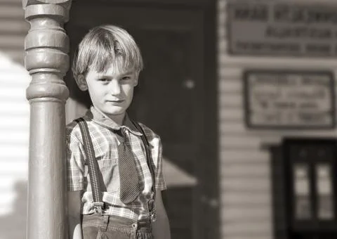 Boy in front of shop Stock Photos