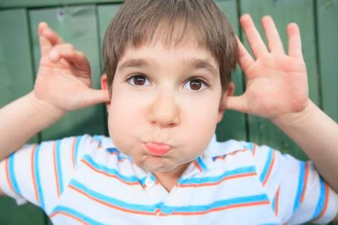 A boy with a funny face expression Stock-Fotos