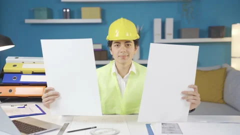 Boy future engineer builder architect looking at projects. Stock-Footage 233571831