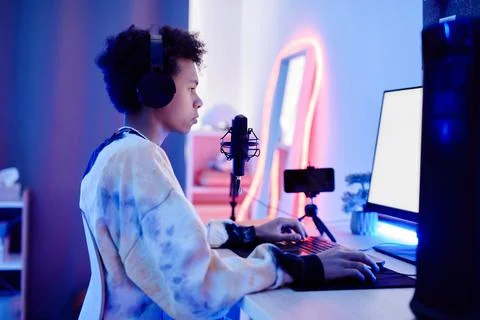Boy Gaming in Neon Light Stock Photos