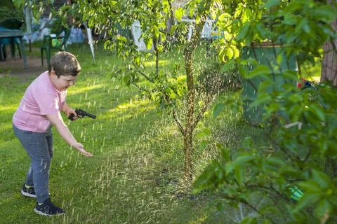 Boy in a garden 库存照片