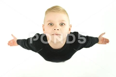 The boy gesture and look to the camera. View from above Stock Photos