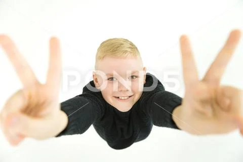 The boy gesture to the camera. View from above Stock Photos