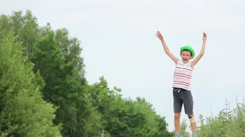 Boy Gesturing with his Hands, Dancing, Jumping, Fun, Waving at the Camera Stock Footage 57959757