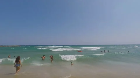 Boy Gets Hit By a Wave On The Beach In The Seaside Vídeo Stock 68828948