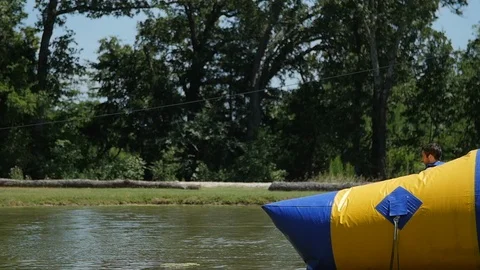Boy gets launched into lake in slow-motion Video stock 118722005
