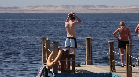 Boy gets ready for snorkeling, El Fanar, Sharm El Sheikh, Egypt Stock Footage 39378650