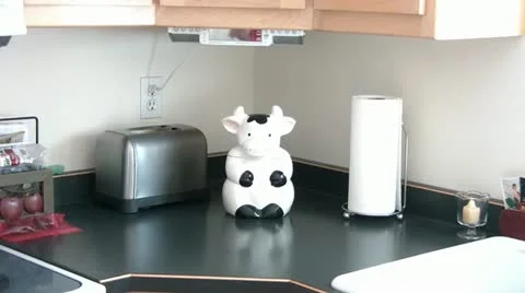 Boy Getting Cookie Out of Jar Stockbeeldmateriaal 12571707