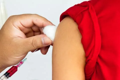 Boy getting an injection. Stock Photos