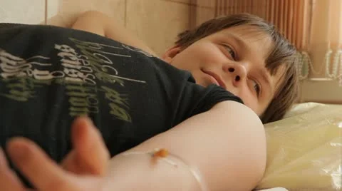 A boy getting an intravenous infusion Stock Footage 12354947