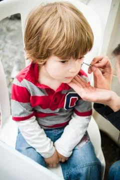 Boy getting make-up drawing Foto stock