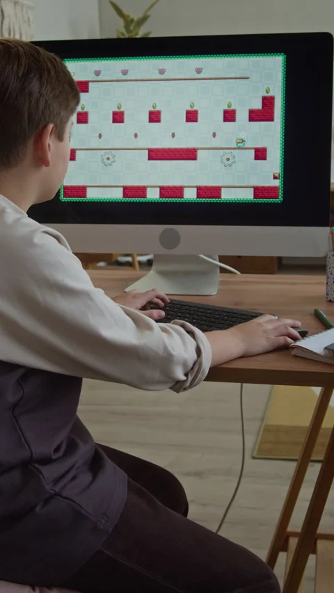 Boy Getting Parental Control Lock while Playing Arcade on Computer Stock Footage 332778178
