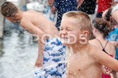 Boy getting splashed Stock Photos