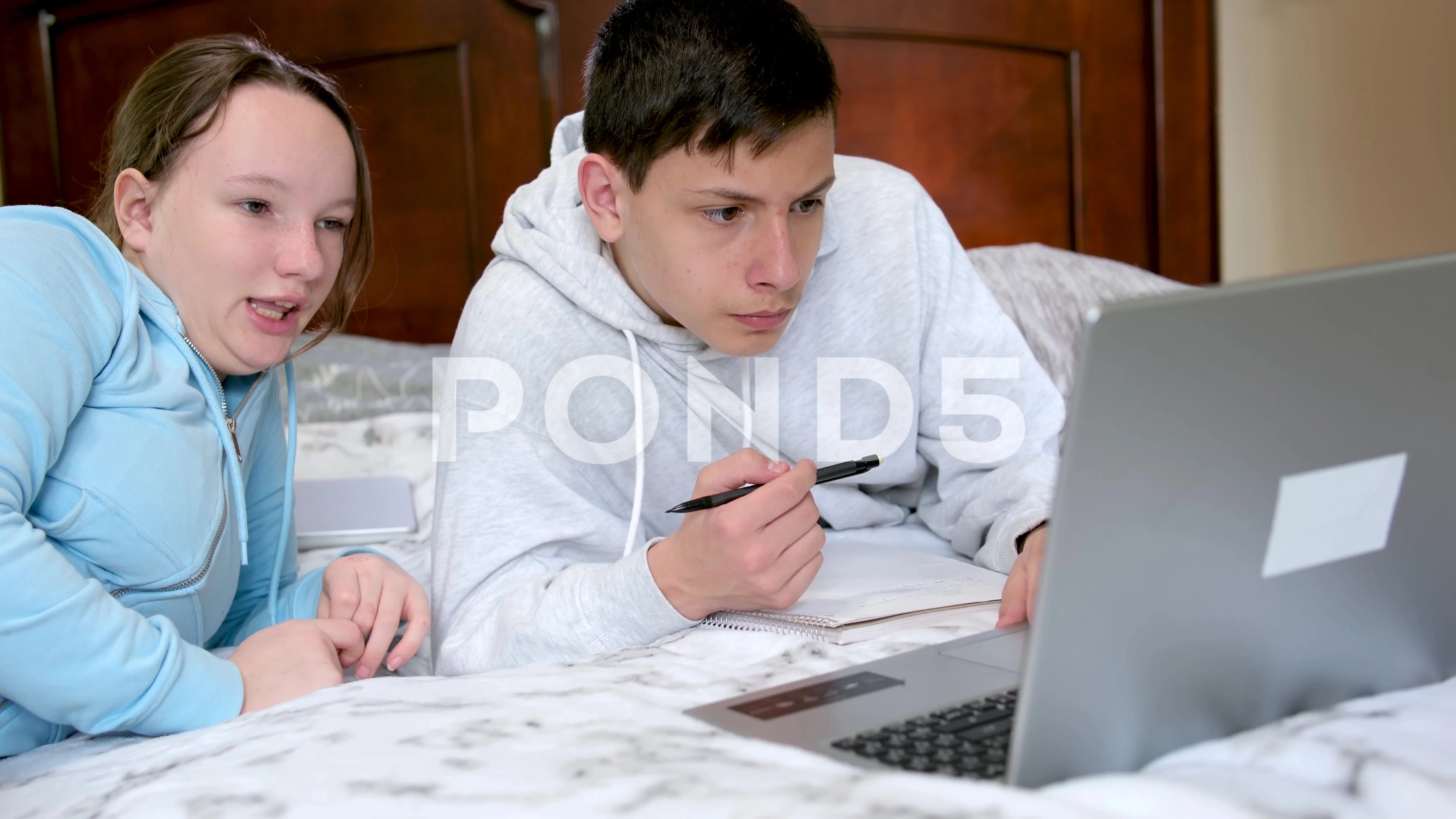 boy girl watching online lesson sitting near computer twins brother and  sister