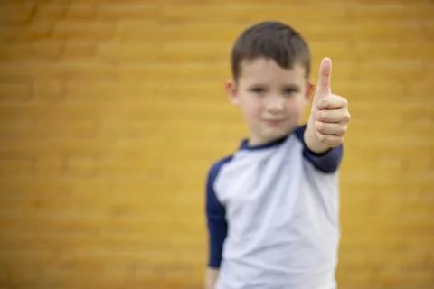Boy Giving Thumbs Up to Camera Stock Photos