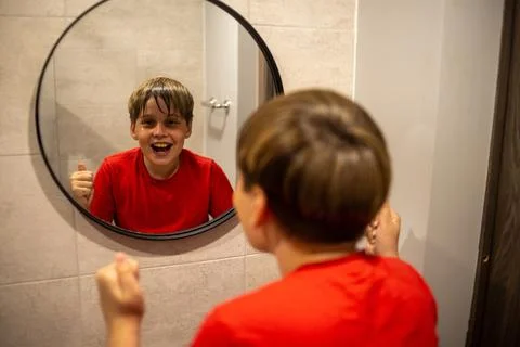 Boy Giving Thumbs Up To Mirror Reflection Stock Photos