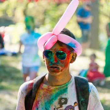 Boy with glasses having fun during the festival of color Stock Photos