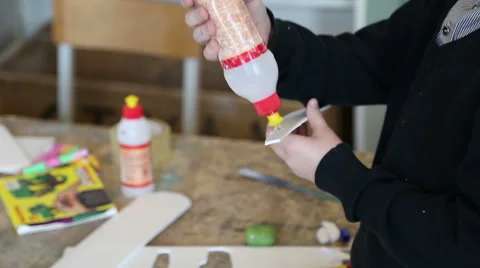 The boy glues a model airplane Stock Footage 59112548