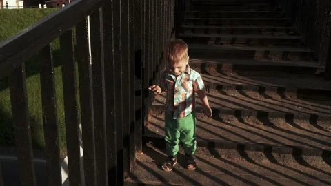 The boy goes down on nature 스톡 동영상 133564507