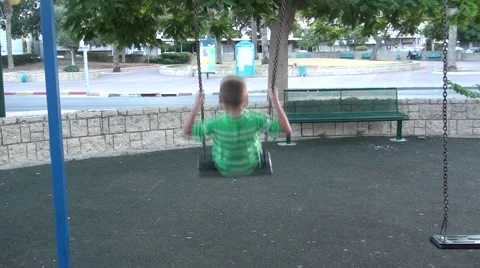A boy goes for a drive on a swing Stock Footage 41852461