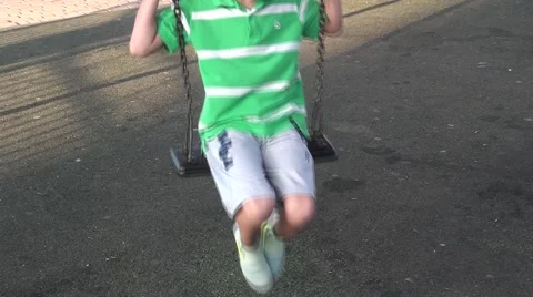 A boy goes for a drive on a swing Stock Footage 41852545