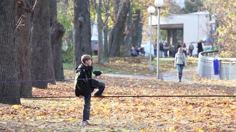 Boy goes on a rope Stock Footage 45990859