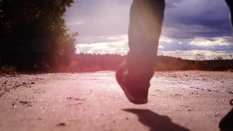 The boy goes to school. The boy is walking at sunset. Stock Footage 96066894
